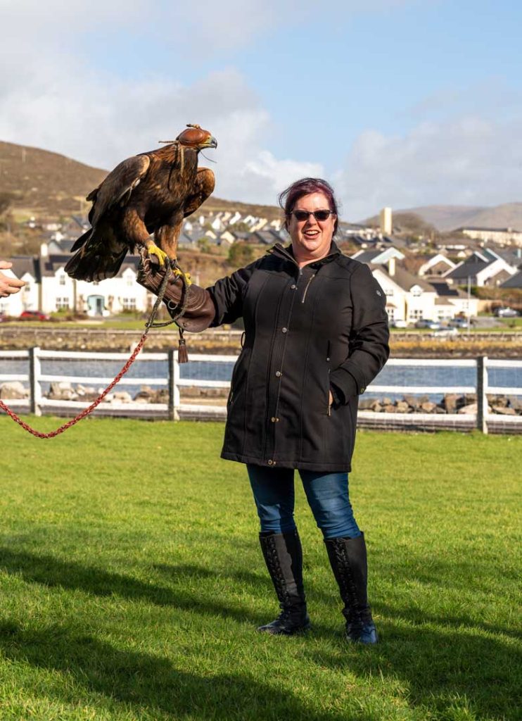 A woman holding a bird